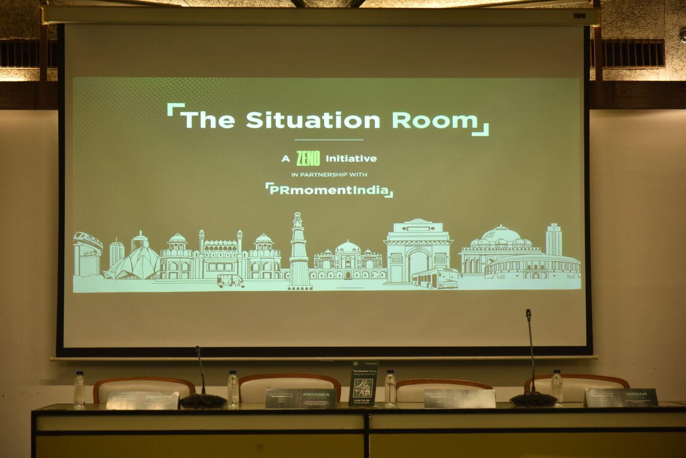 'The Situation Room' title slide above the empty panel table, nameplates and mics set