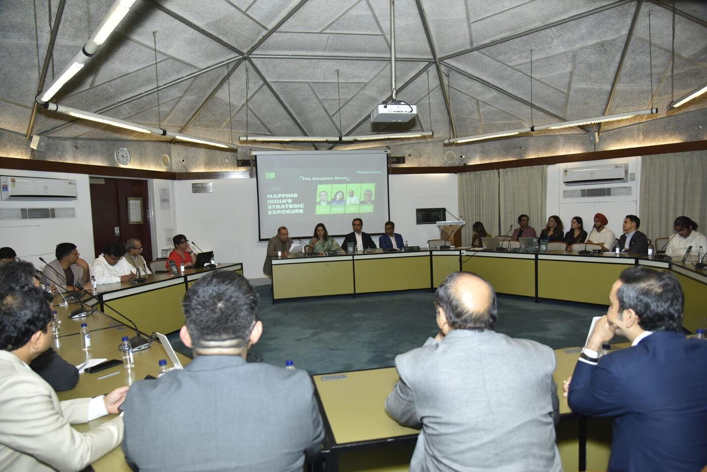 Wide of the domed horseshoe committee room, the full ring of delegates around the table